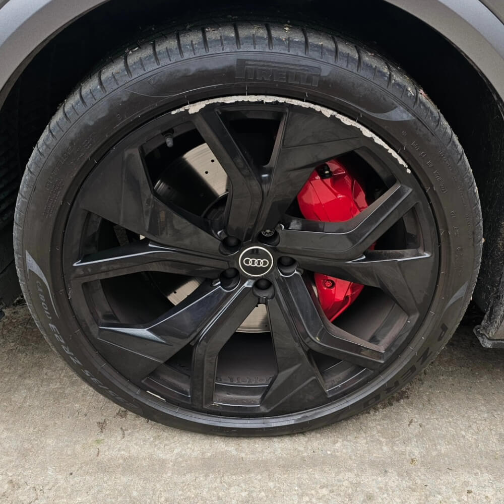 Alloy wheel with kerb damage before repair